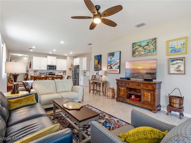 living room featuring light tile patterned floors, visible vents, a ceiling fan, and recessed lighting