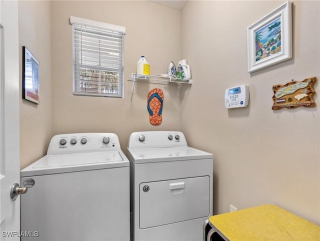 washroom with laundry area and separate washer and dryer