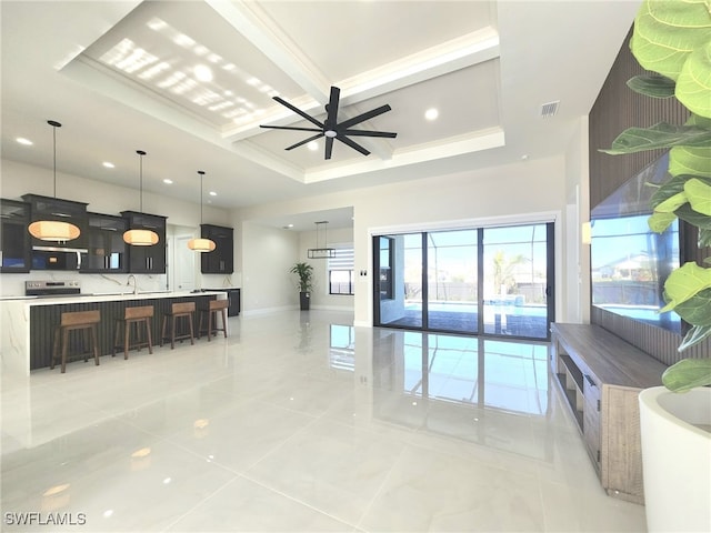 living room featuring beamed ceiling, ceiling fan, and coffered ceiling