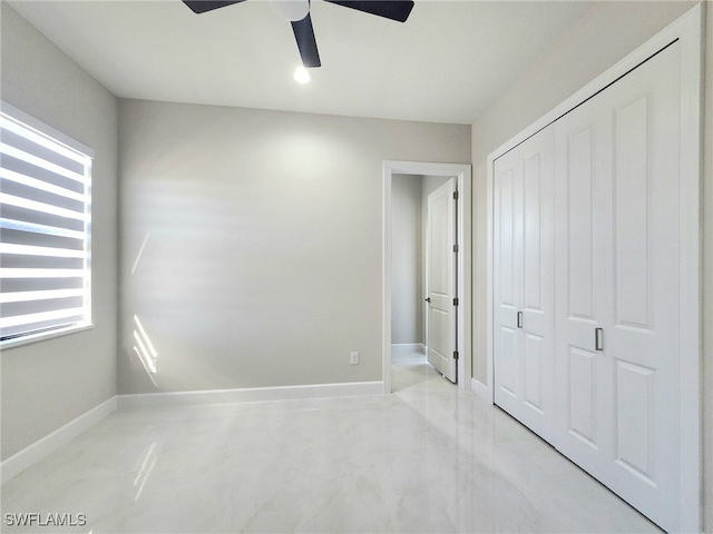 unfurnished bedroom with a closet and ceiling fan