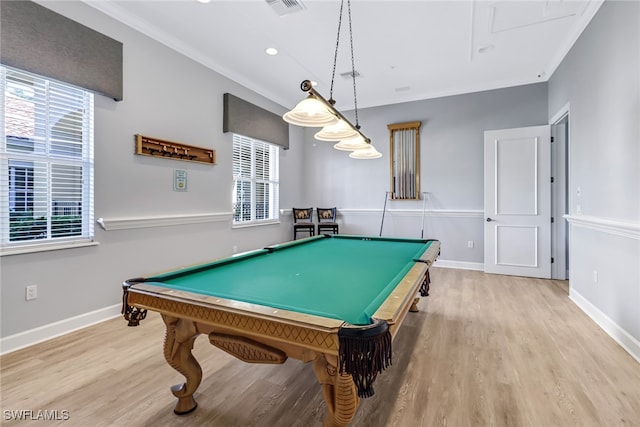 rec room with pool table, ornamental molding, and light hardwood / wood-style floors