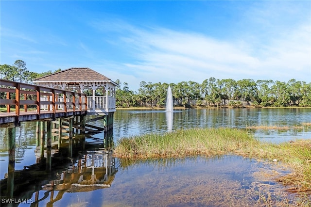 view of dock featuring a water view and a gazebo