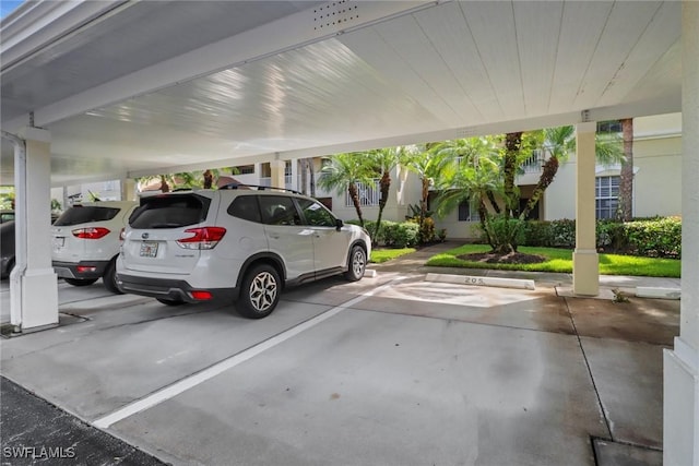 view of parking / parking lot with a carport