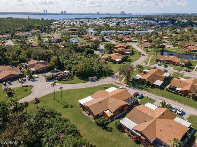 aerial view with a water view and a residential view