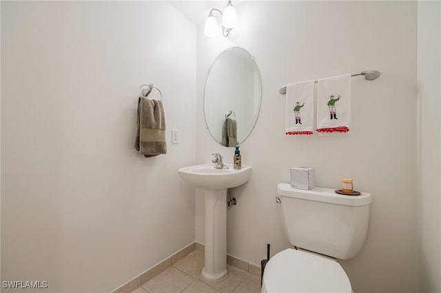 bathroom featuring toilet and tile patterned flooring