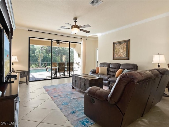 tiled living room featuring crown molding and ceiling fan