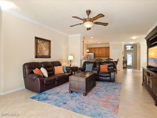 living room featuring ornamental molding, light tile patterned floors, and ceiling fan