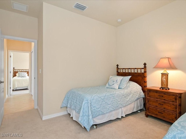 bedroom featuring light colored carpet