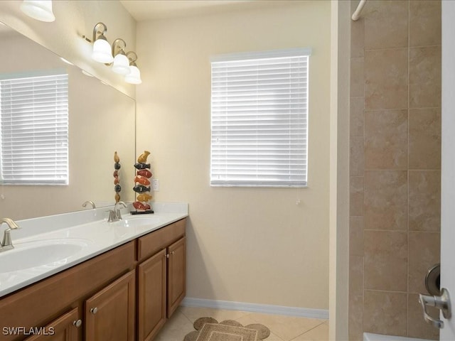 bathroom with vanity, plenty of natural light, and tile patterned floors