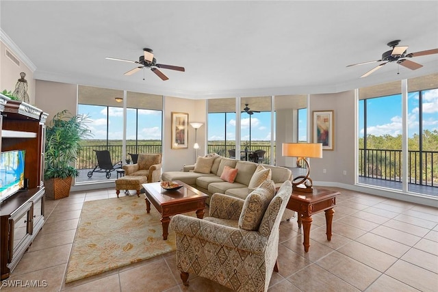 living area featuring visible vents, a wall of windows, and a ceiling fan