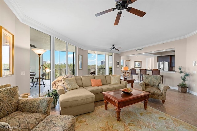 living room featuring expansive windows, ornamental molding, and light tile patterned floors