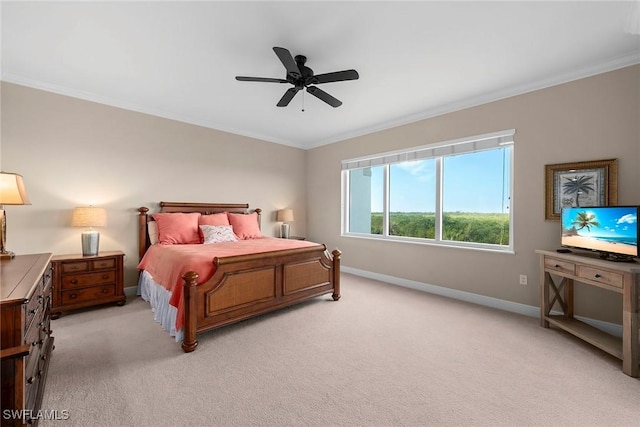 bedroom featuring crown molding, light colored carpet, and ceiling fan