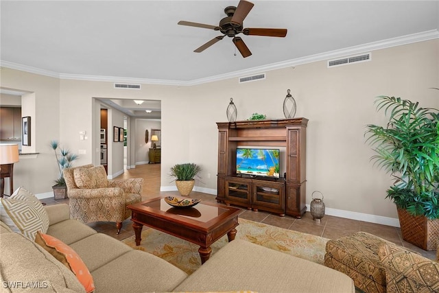 living room featuring crown molding, light tile patterned floors, a ceiling fan, and visible vents