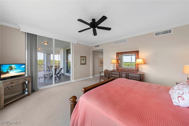 carpeted bedroom featuring crown molding, ceiling fan, multiple windows, and access to outside