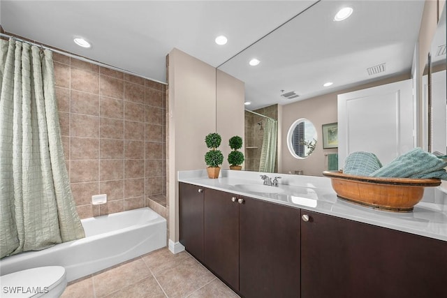 full bathroom featuring tile patterned flooring, vanity, shower / bath combination with curtain, and toilet