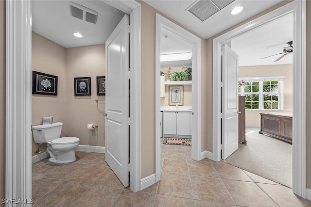 bathroom featuring tile patterned floors, toilet, and visible vents