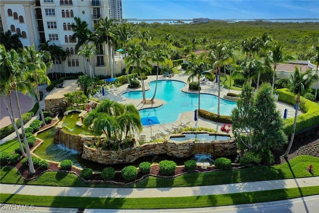 view of pool featuring a hot tub and a patio area