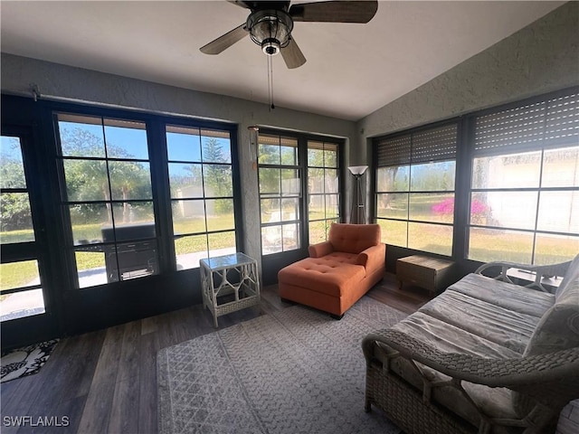 sunroom / solarium with lofted ceiling and ceiling fan