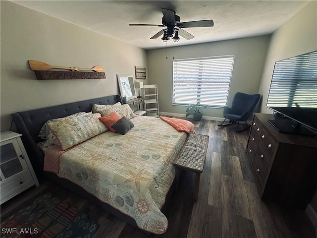 bedroom featuring dark hardwood / wood-style flooring and ceiling fan