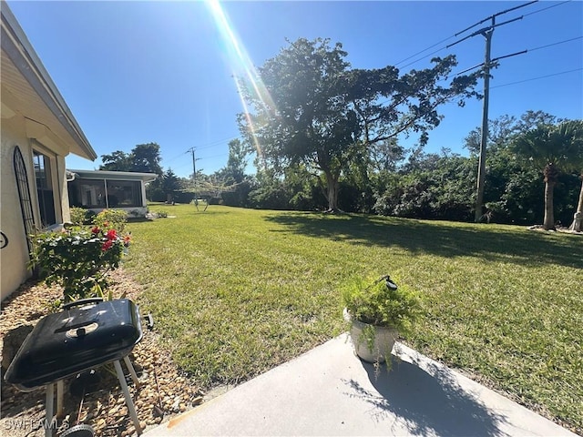 view of yard featuring a sunroom