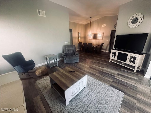 16660 Coriander Ln, Fort Myers, FL 33908 - living area featuring wood finished floors, baseboards, lofted ceiling, and visible vents