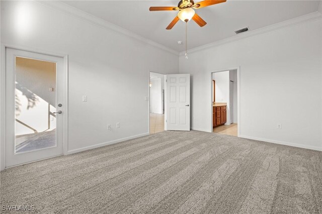 carpeted empty room with crown molding and ceiling fan