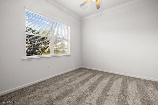 empty room featuring ceiling fan, ornamental molding, and carpet flooring