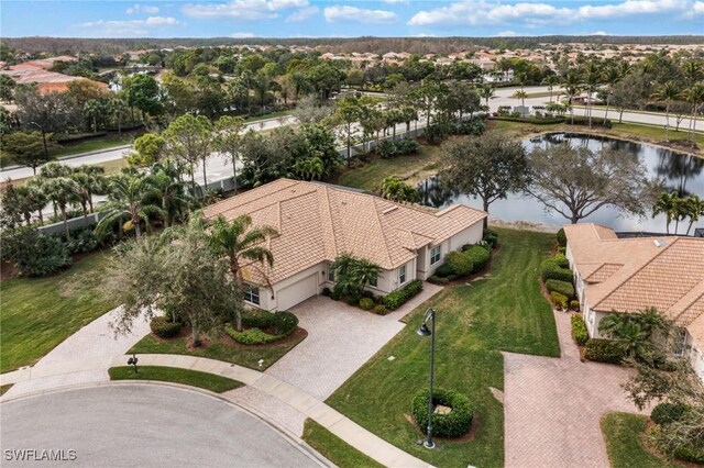 birds eye view of property with a water view