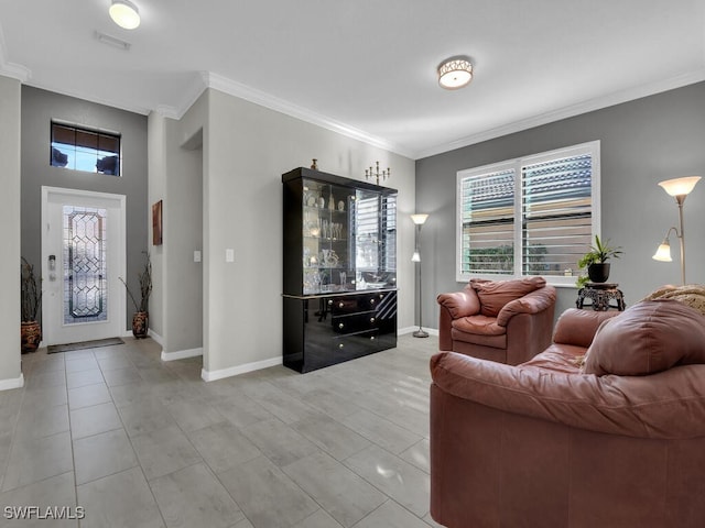 living room featuring tile patterned flooring, crown molding, and a wealth of natural light