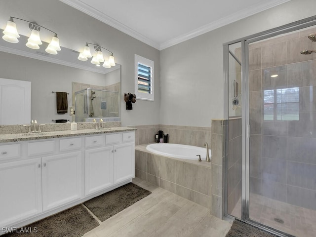 bathroom with ornamental molding, shower with separate bathtub, and vanity