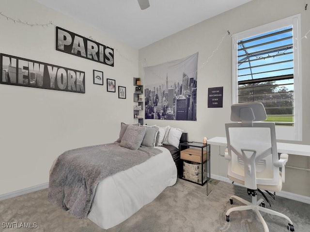 bedroom with light carpet and ceiling fan