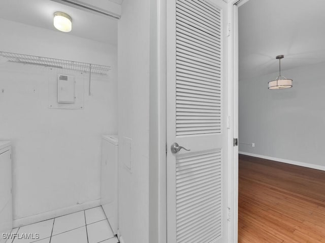 interior space with separate washer and dryer and light hardwood / wood-style flooring