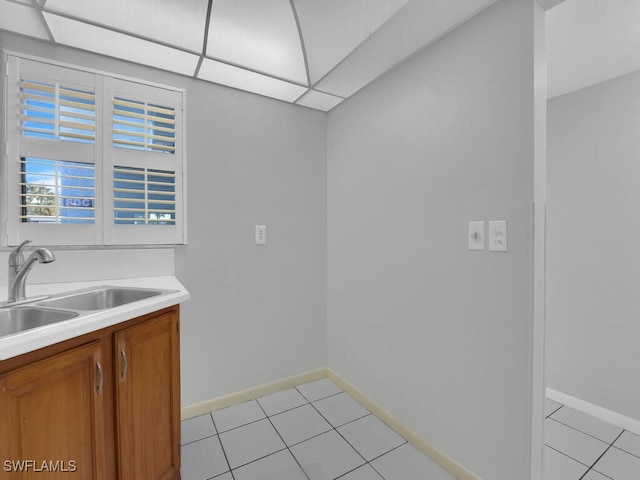 kitchen with sink and light tile patterned floors