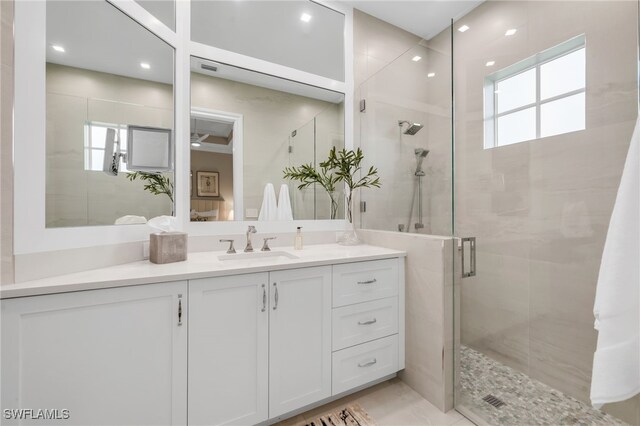 455 1st Ave N, Naples, FL 34102 - bathroom with a stall shower and vanity