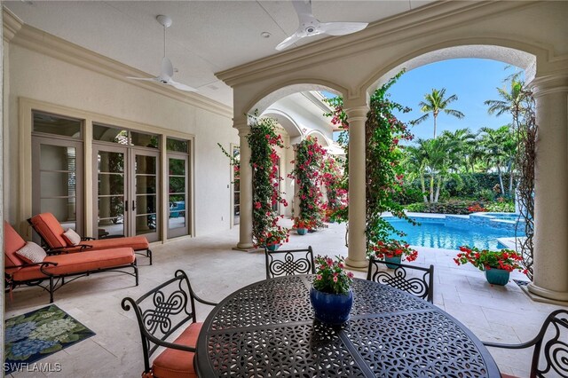 455 1st Ave N, Naples, FL 34102 - view of patio / terrace with ceiling fan, outdoor dining space, french doors, and a pool with connected hot tub
