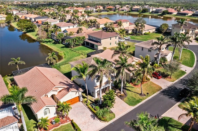 bird's eye view featuring a residential view and a water view