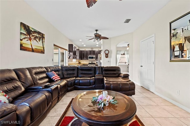 living area featuring light tile patterned floors, ceiling fan, recessed lighting, visible vents, and baseboards