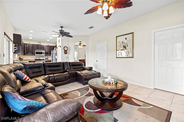 living area with light tile patterned floors, recessed lighting, visible vents, ceiling fan, and baseboards