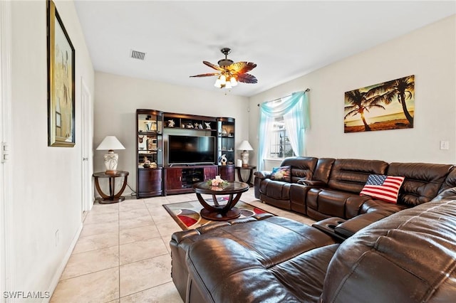 living area featuring ceiling fan, visible vents, and light tile patterned flooring