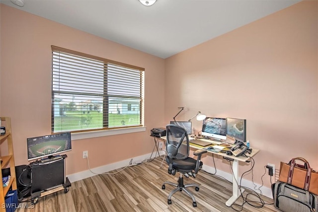 office area with light hardwood / wood-style floors