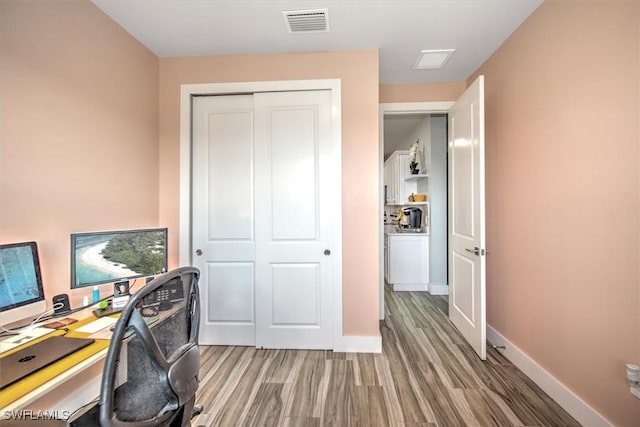 home office featuring hardwood / wood-style flooring