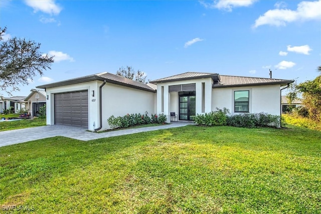 view of front of home featuring a garage and a front yard