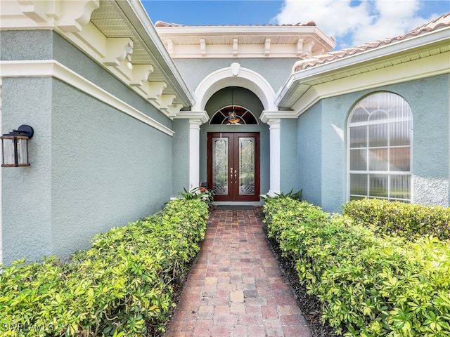 view of exterior entry featuring french doors