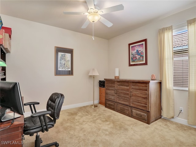 carpeted office featuring ceiling fan