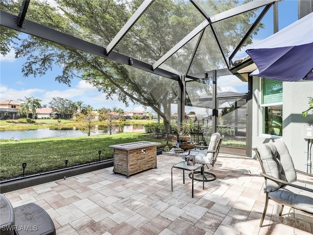 sunroom / solarium featuring a water view