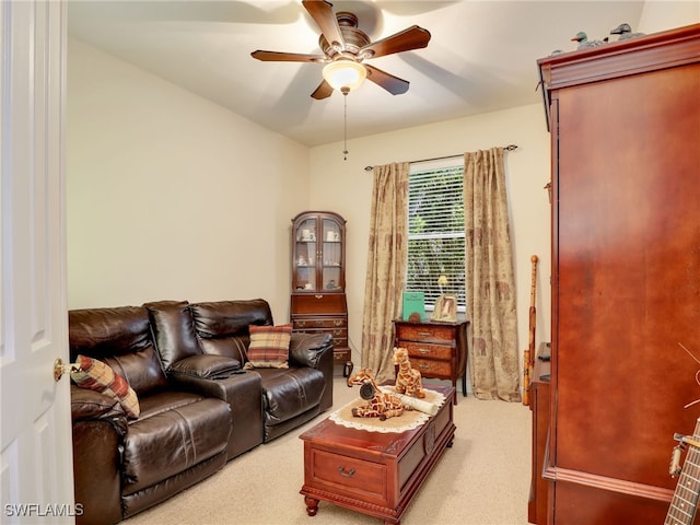 carpeted living room featuring ceiling fan