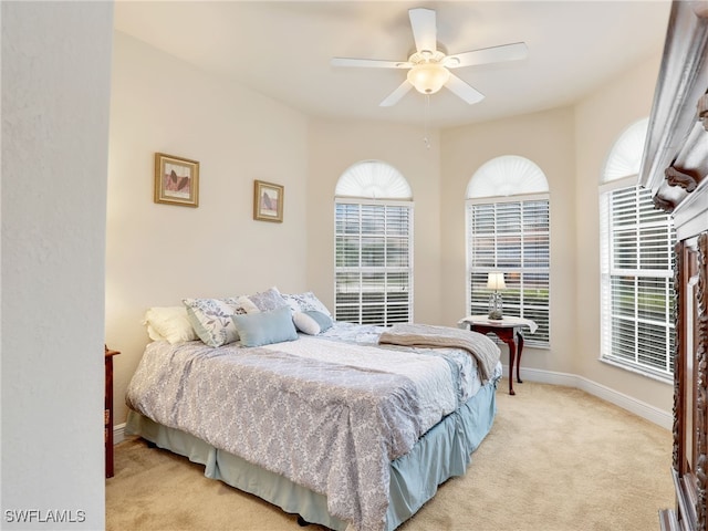 bedroom with light carpet and ceiling fan