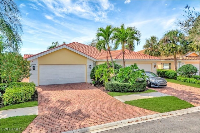 mediterranean / spanish-style home featuring a garage