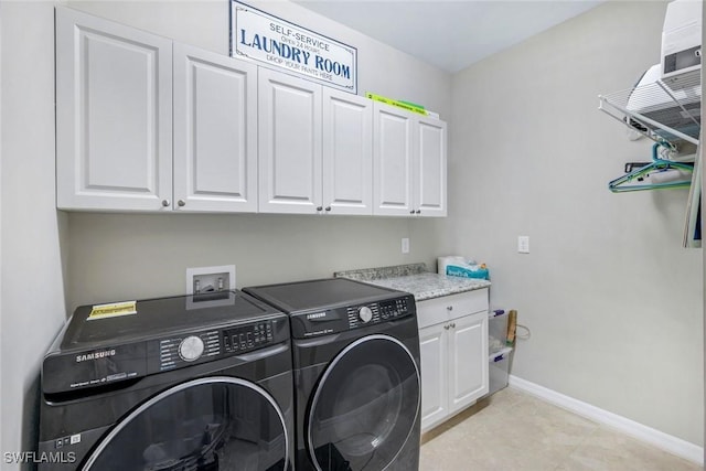 9368 Night Heron Ln, Naples, FL 34120 - washroom featuring cabinet space, washer and dryer, baseboards, and light tile patterned floors