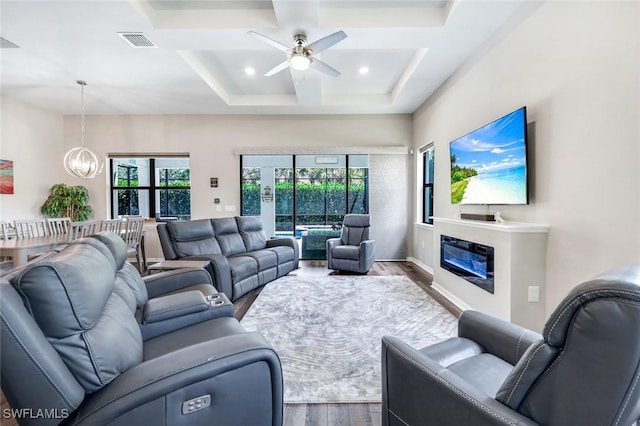 9368 Night Heron Ln, Naples, FL 34120 - living area with wood finished floors, coffered ceiling, a chandelier, ceiling fan, and beam ceiling